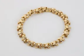 7 Tiffany & Co. 18k Yellow Gold Vintage Signature X Bracelet (28.78g.)