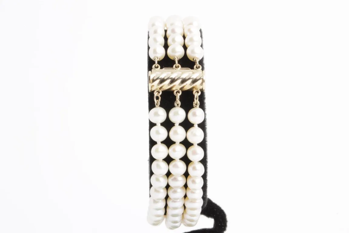 7.5'' 14k Yellow Gold 3 Strand Pearl Bracelet (19.40g.)